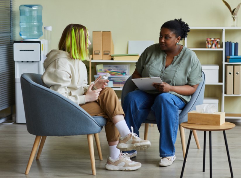 Teenager talking to counsellor