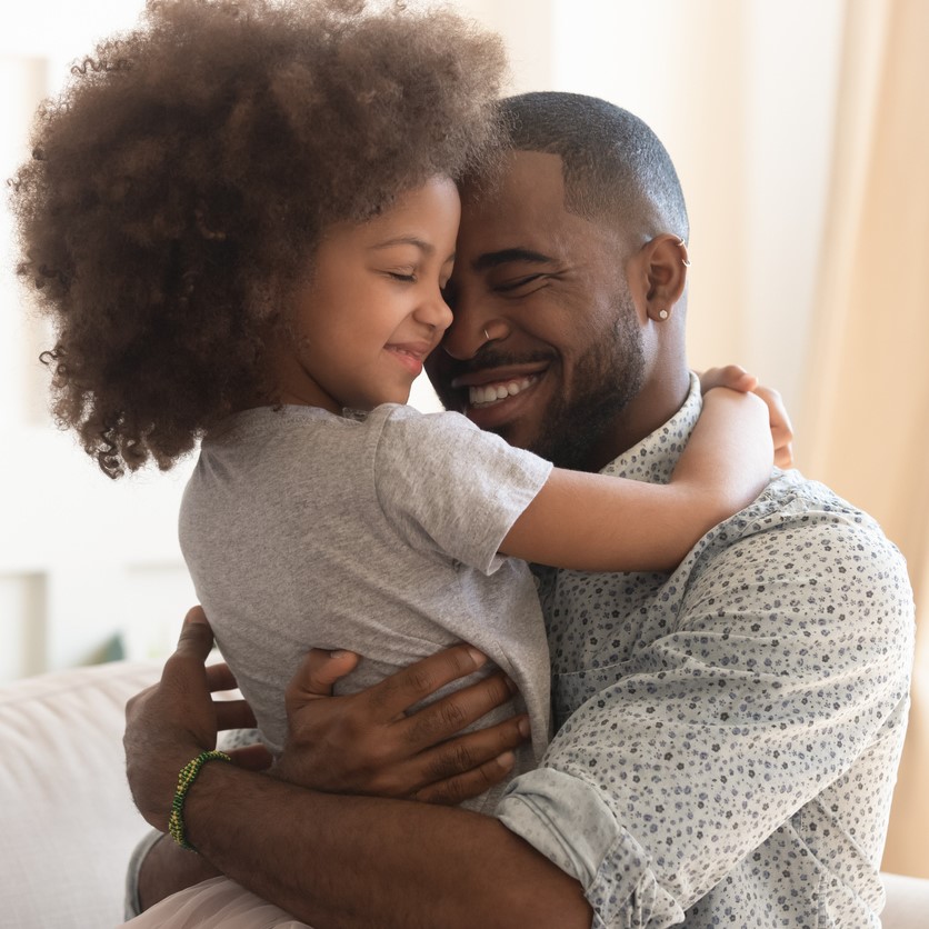 Dad hugs daughter