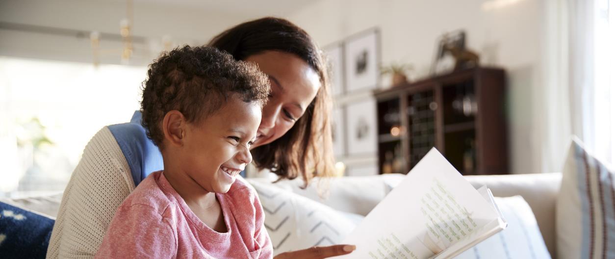 Mom reads book to child