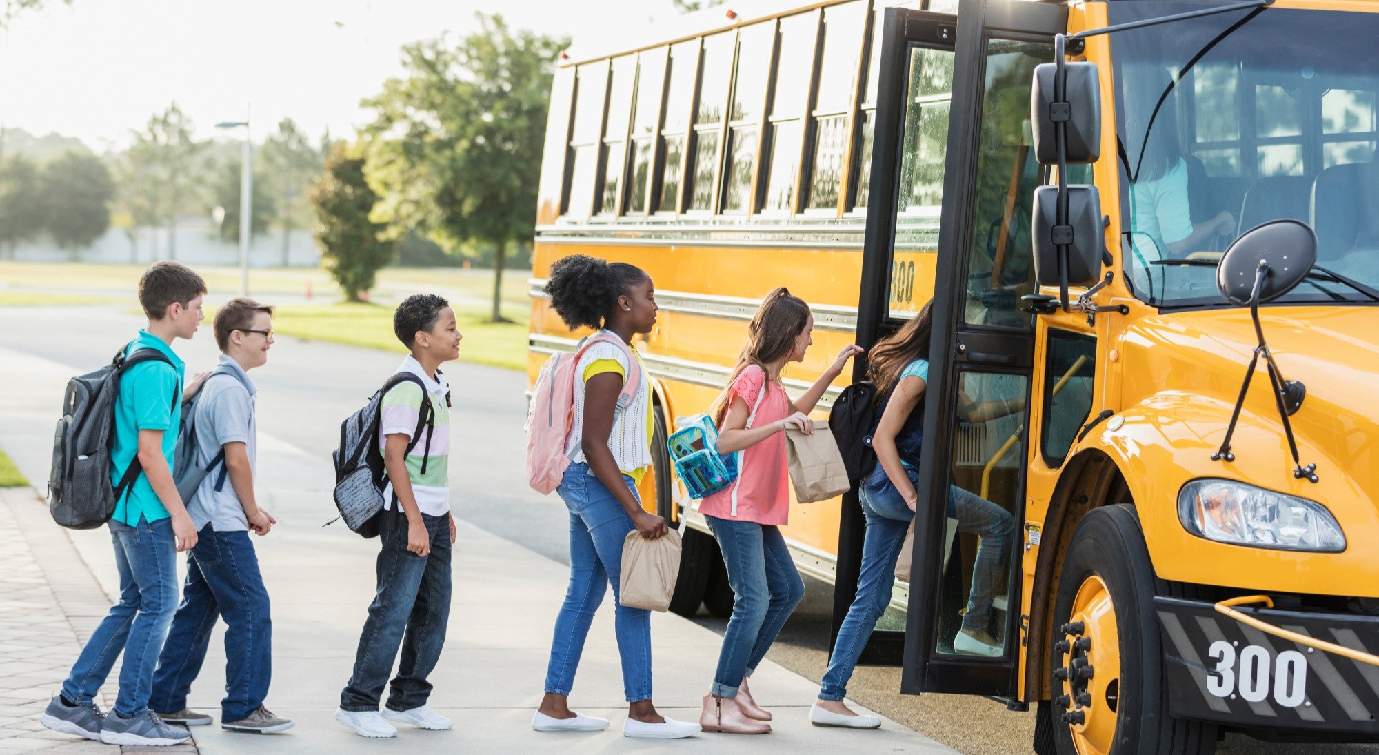 Students getting on a school bus