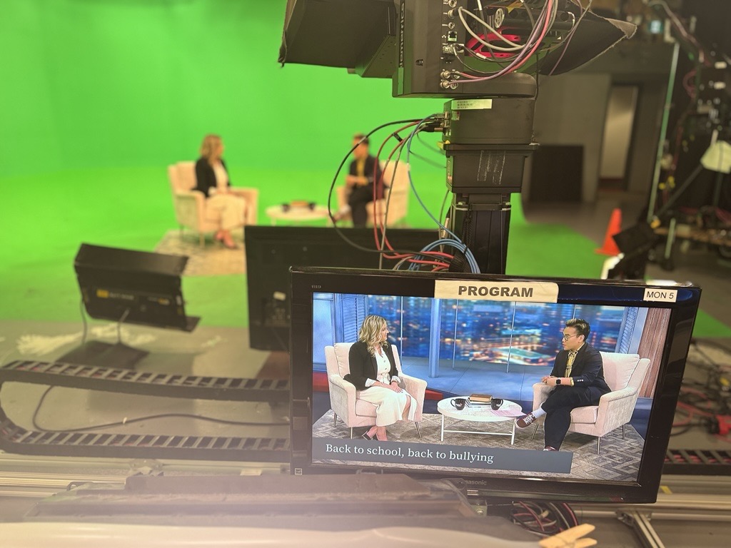 Photo of the monitor showing Mary Beth Moellenkamp speaking to Global News Morning host.